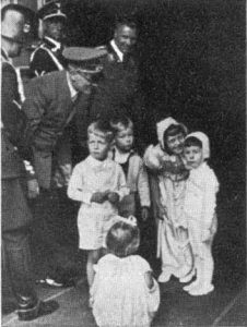 Hitler bending over children