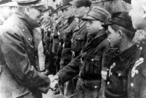 Hitler shaking hands with youth